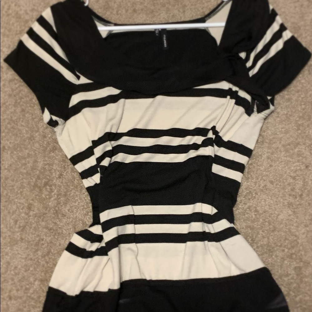 Black and tannish white shirt